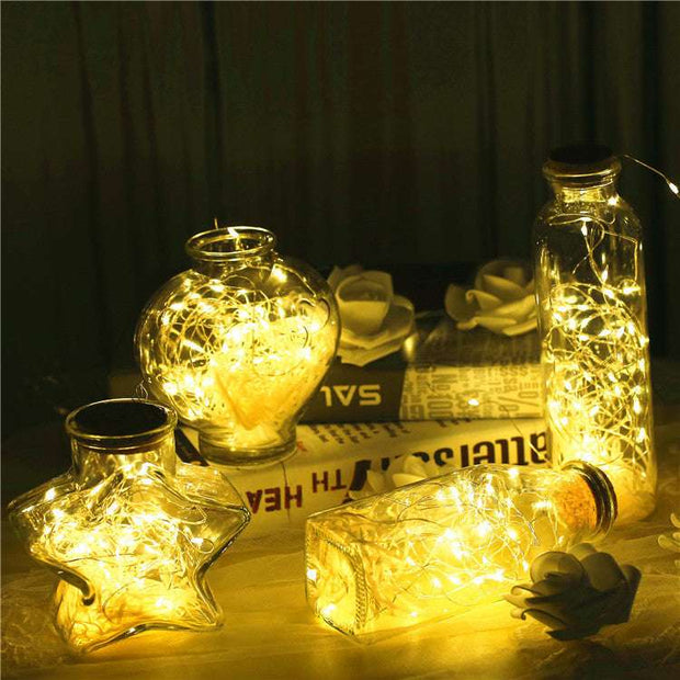 Glass bottle with gypsophila lights
