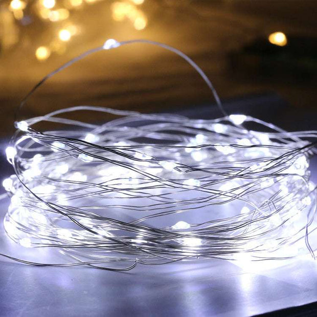 Glass bottle with gypsophila lights White
